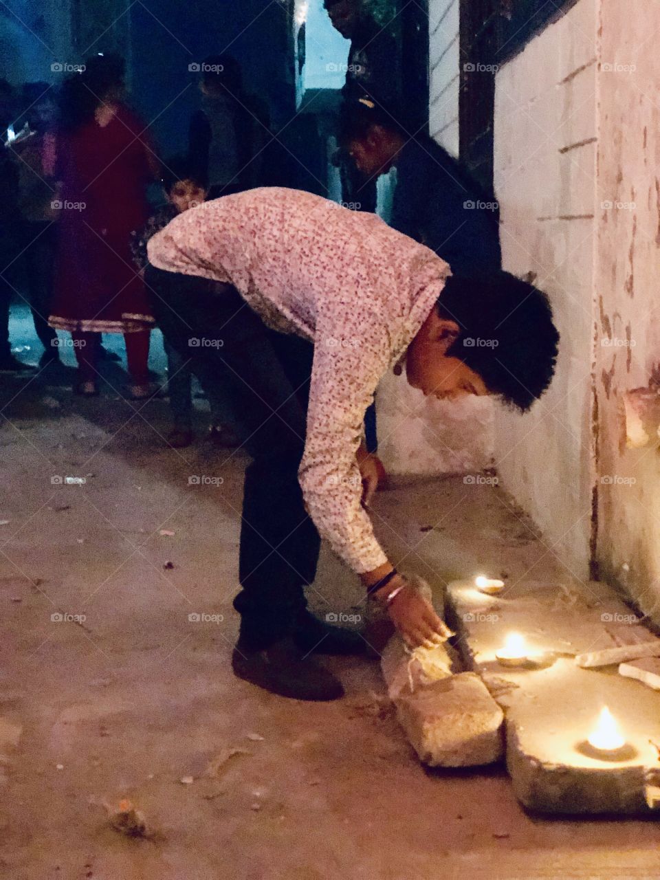 Lighting up his small cracker