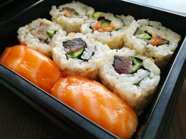Sushi and Sashimi with tuna, salmon, cucumber and seaweed. Japanese food.