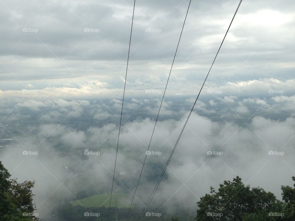 Top of the mountain above the clouds