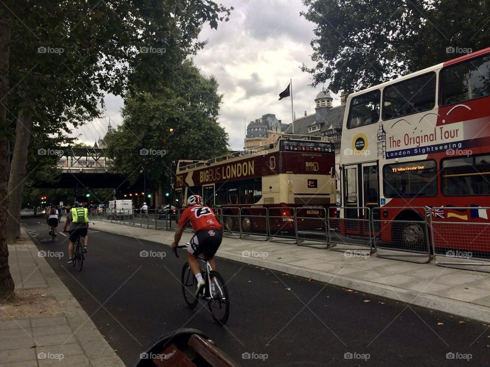 Public transport buses in London with cycle lane for ease of commuting