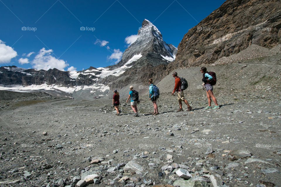A family hike beneath the Matterhorn on a beautiful day