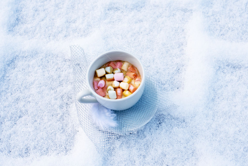 coffee with marshmallow on snow