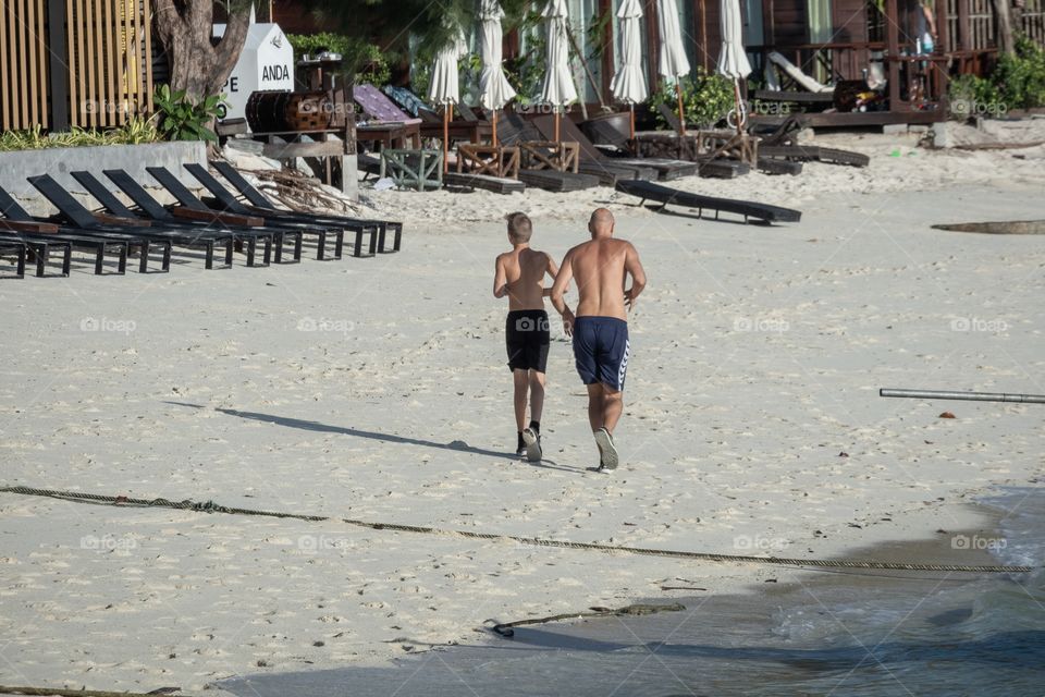 Father and son morning jogging at koh Lipe ,Beautiful island ...Thailand 