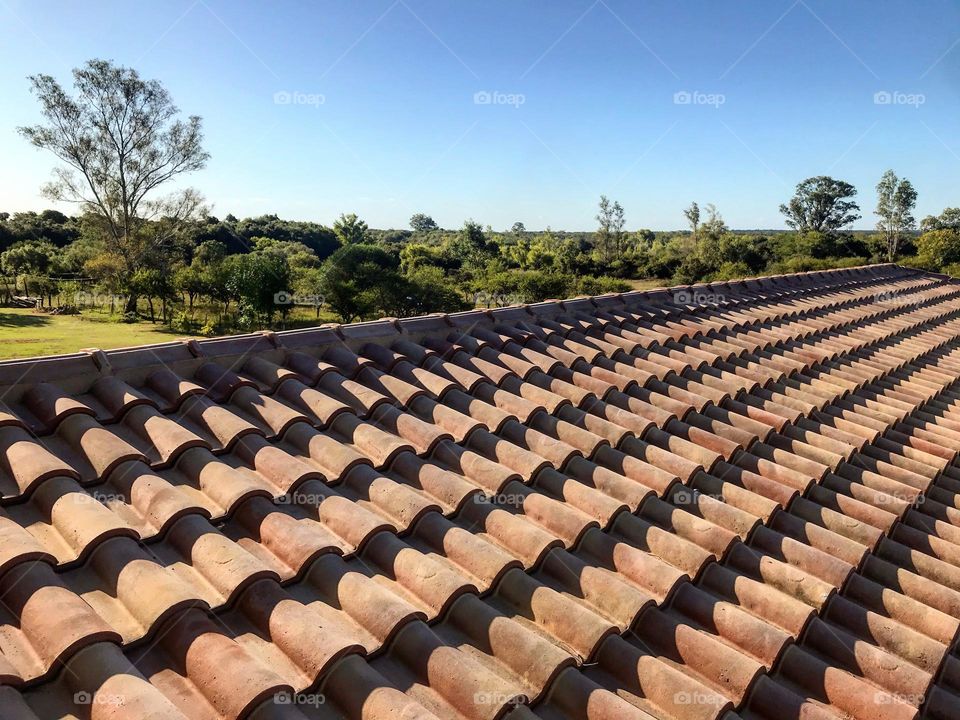 roofing a house with ceramic tiles