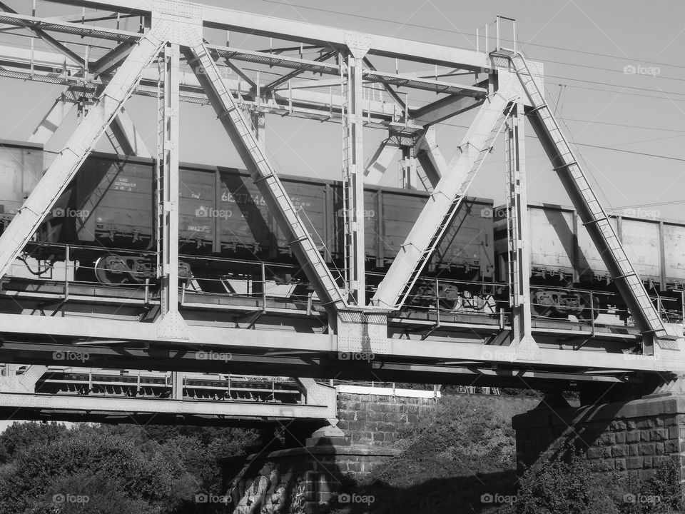 A train on a metal bridge, black and white, Irpin, Ukraine