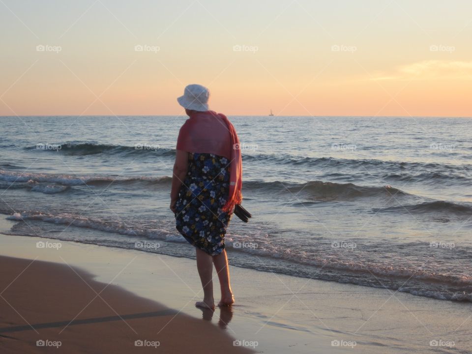 lees of life


. old woman walks on the beach