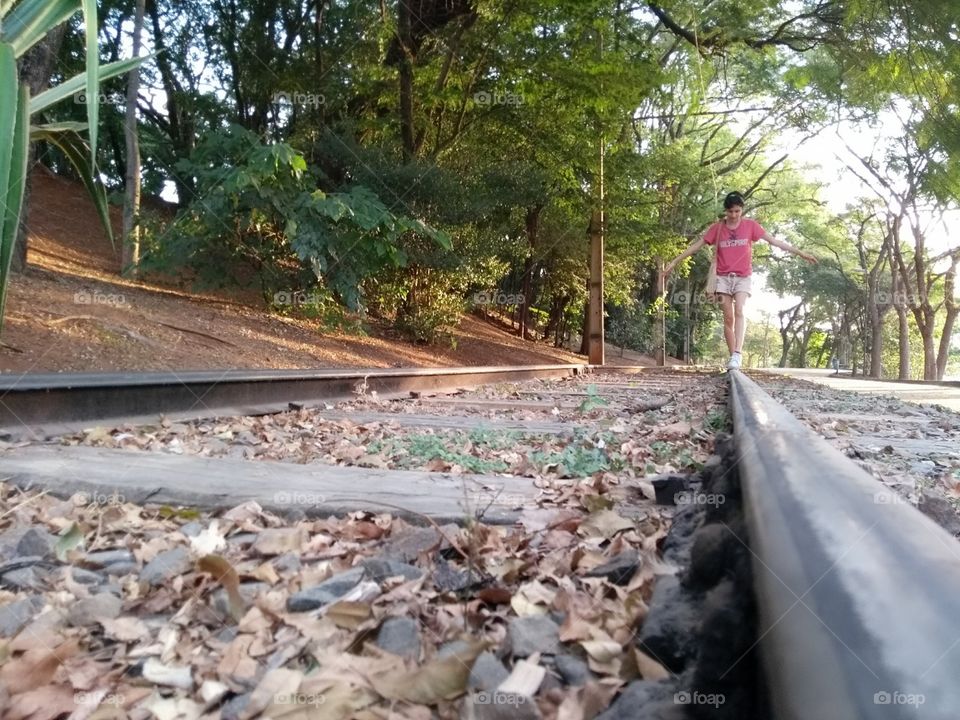person walking on a traintrack