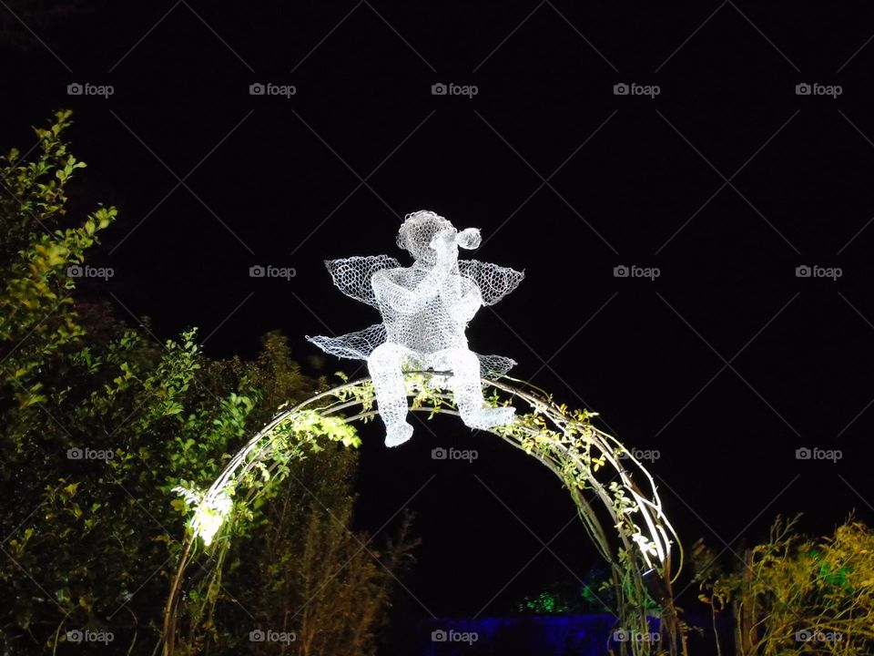 Fairy playing on the trumpet, enlightened wire sculpture, UK