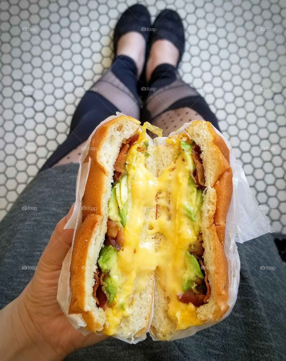avocado bacon egg and cheese on a roll