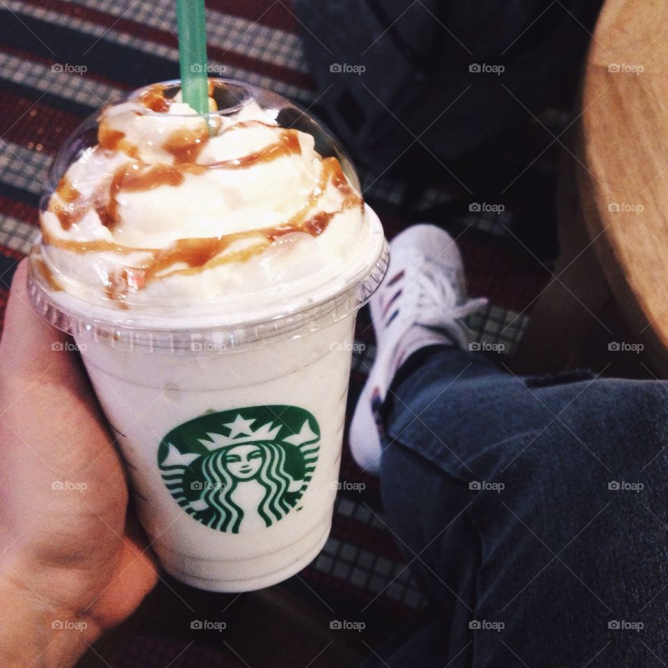 Starbucks Frappuccino in a hand 