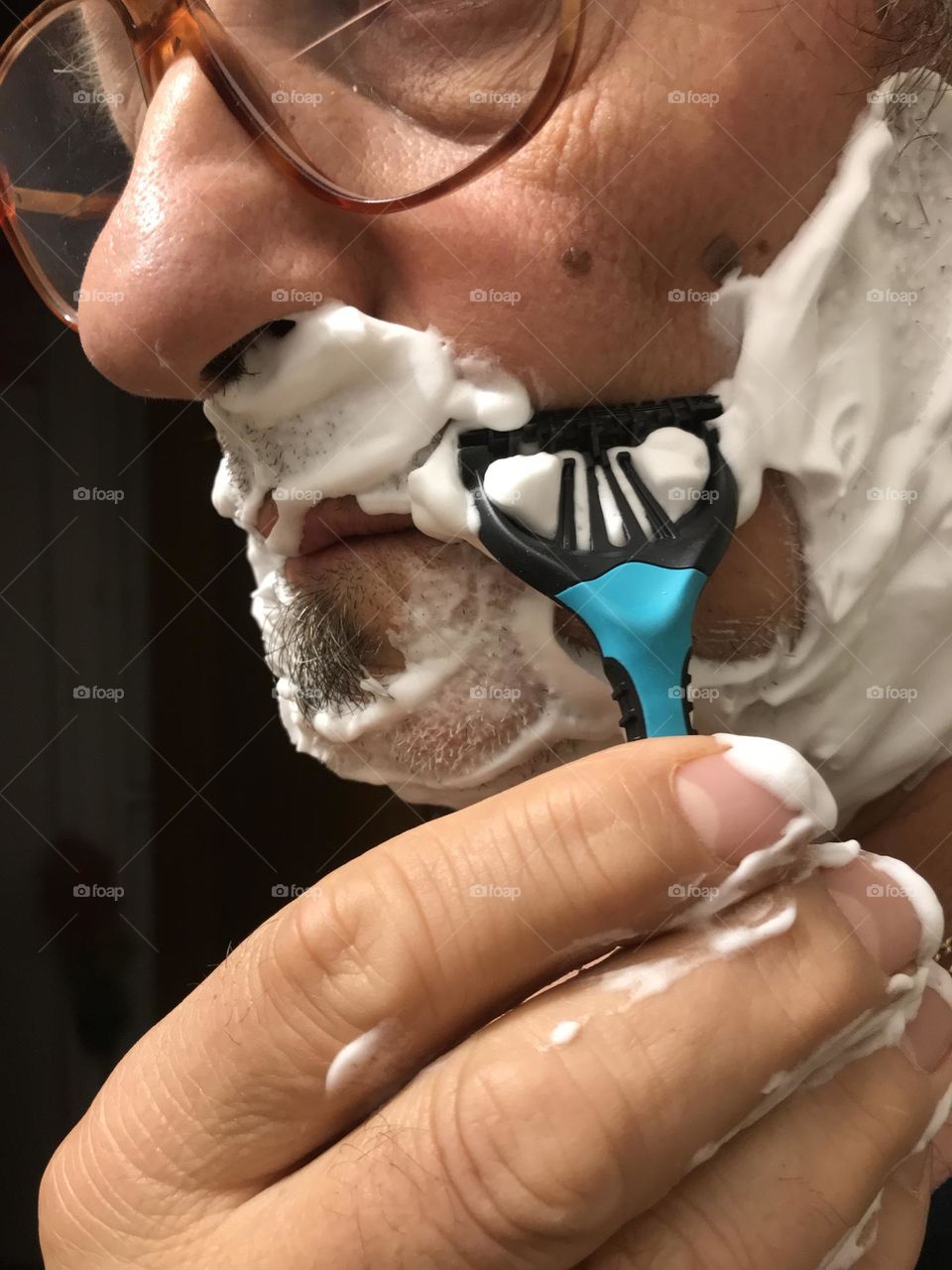 shaving with face foam close up