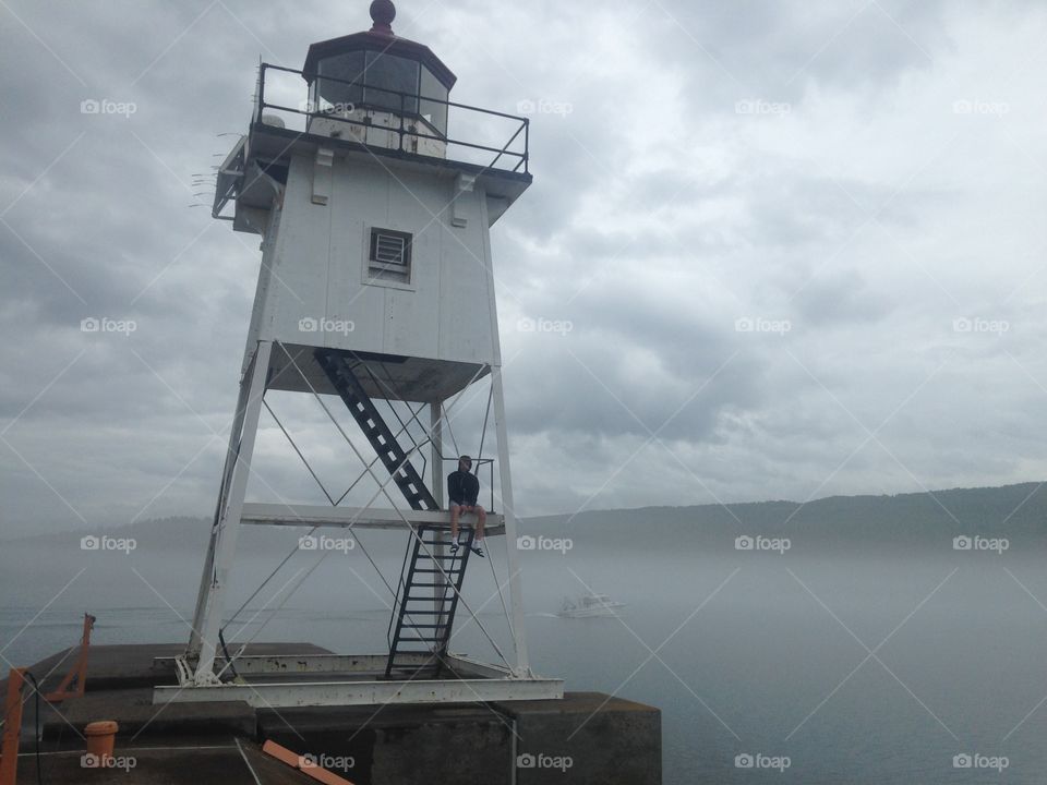 Lighthouse in the bay of Grand Marais, MN on an overcast afternoon