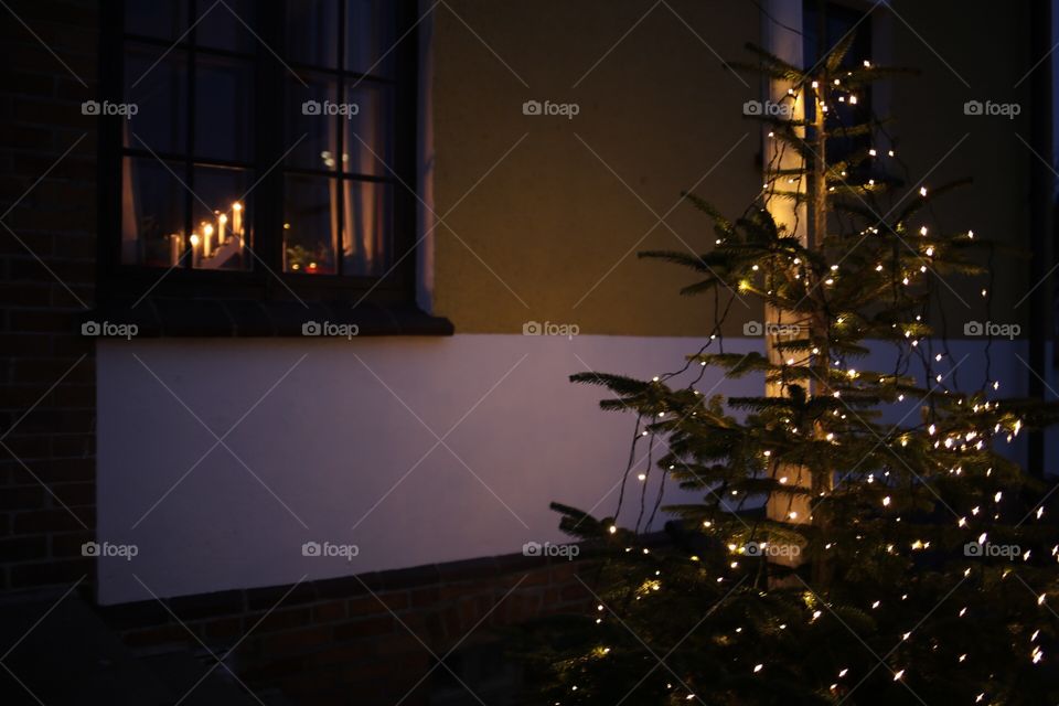 Christmas feeling with Christmas tree outside the window 