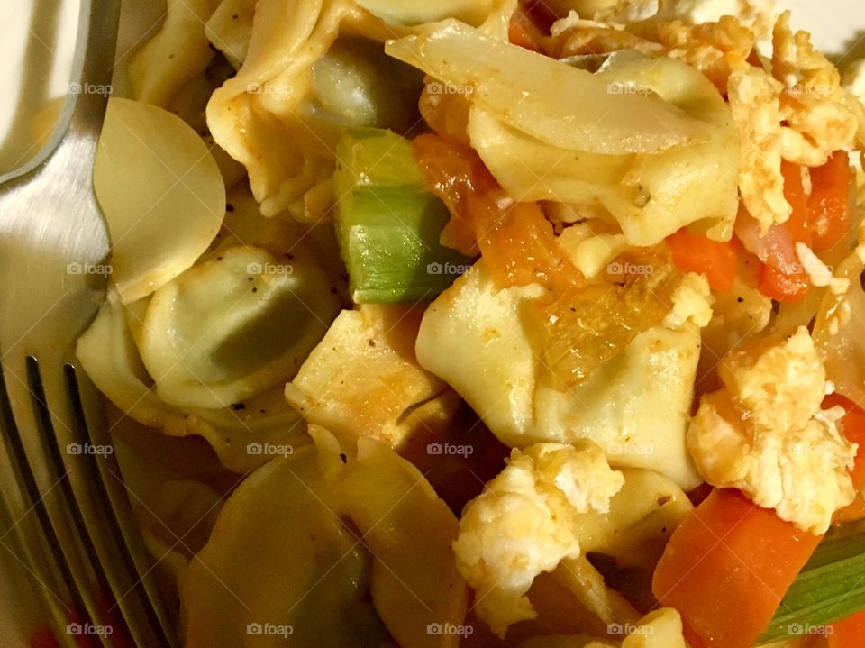 Veal ravioli with tomato, celery, onion and egg.