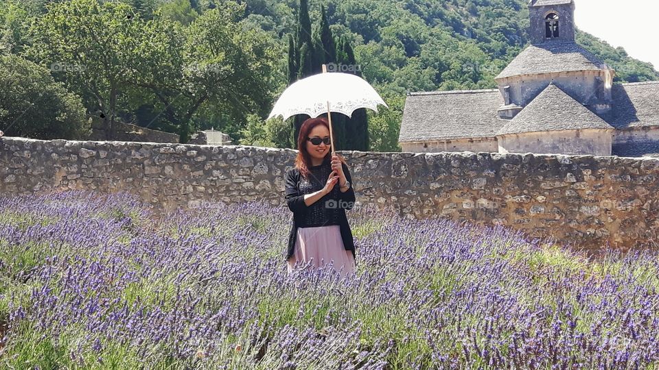 Tourist in front of Senanque Abbey, France.