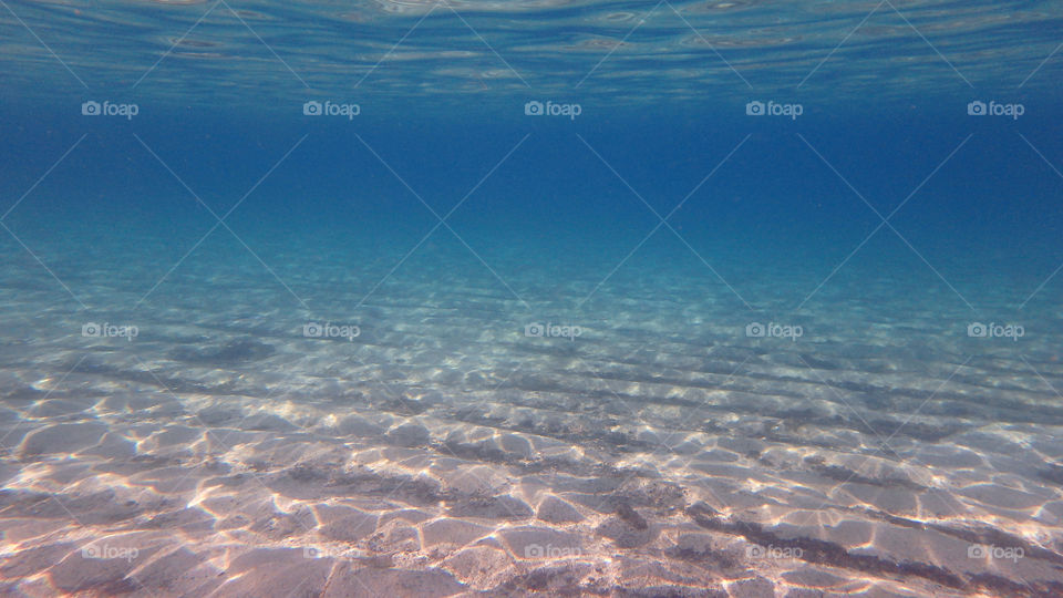 sea and sand in deep blue sea underwater