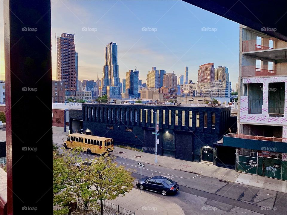 This is the view from halfway up the stairs on the “Greenpoint”, Brooklyn side of the “Pulaski Bridge” at “Newtown Creek”. Far in the distance we see not only LIC, Queens but also “Manhattan”. 2023. Hypnotic Productions