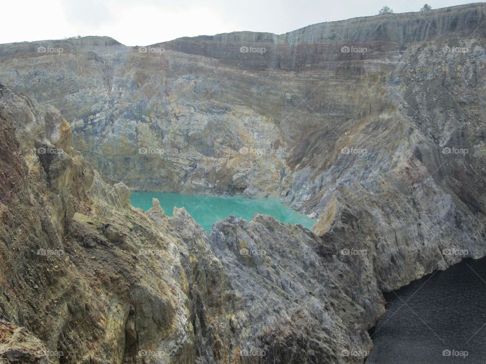 Mountain rocks that form the walls of Lake Kelimutu.