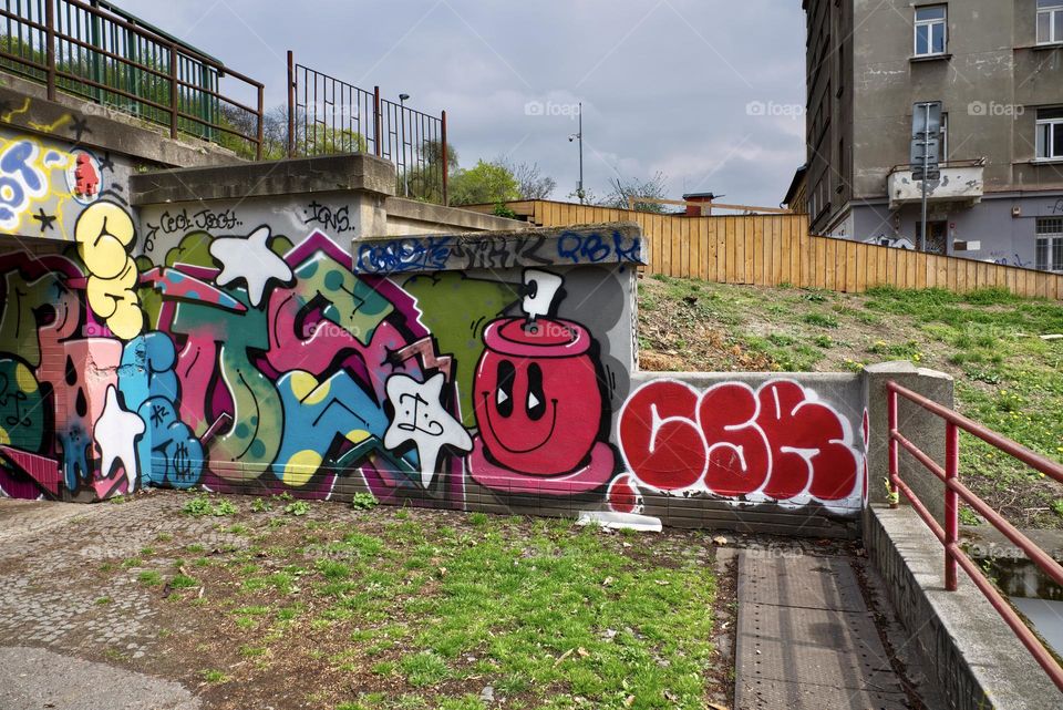 Colorful abstract graffiti and lettering on the wall by the path near Vitkov in Prague, Zizkov.
