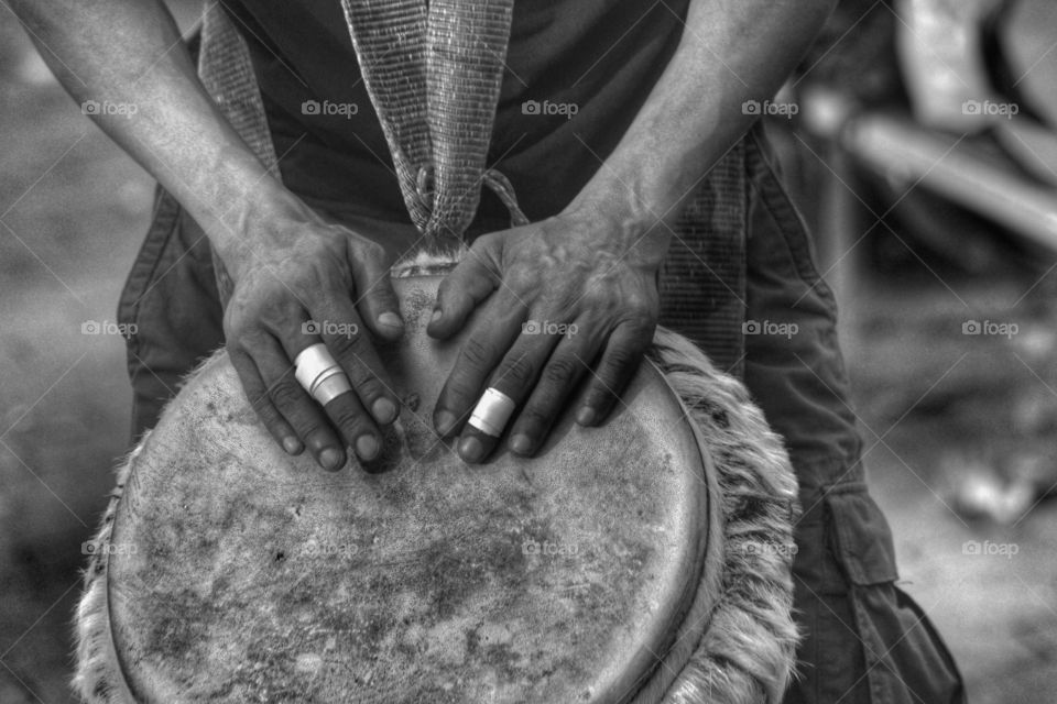 Close-up of hand playing drum