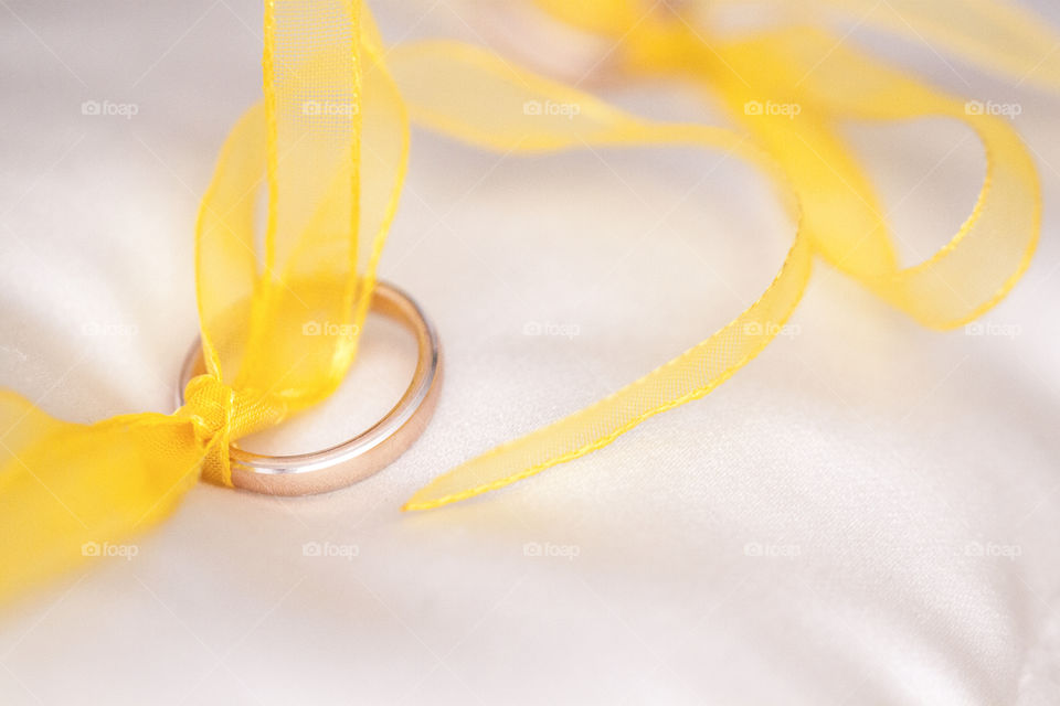 Gold ring and ribbons