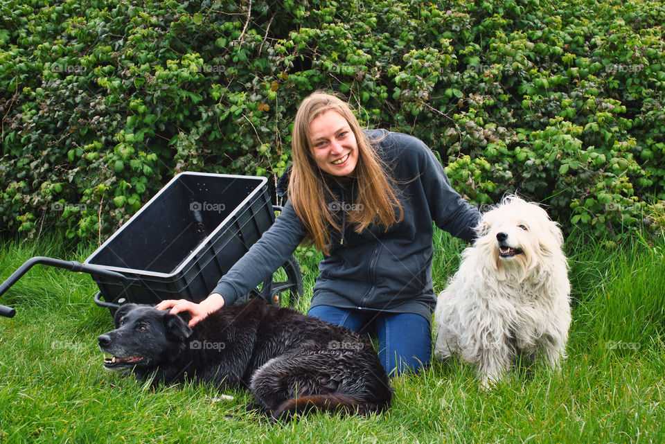 Smiling and playing with dogs