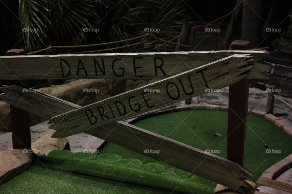 Danger bridge out. Golf putt putt course obstacle 