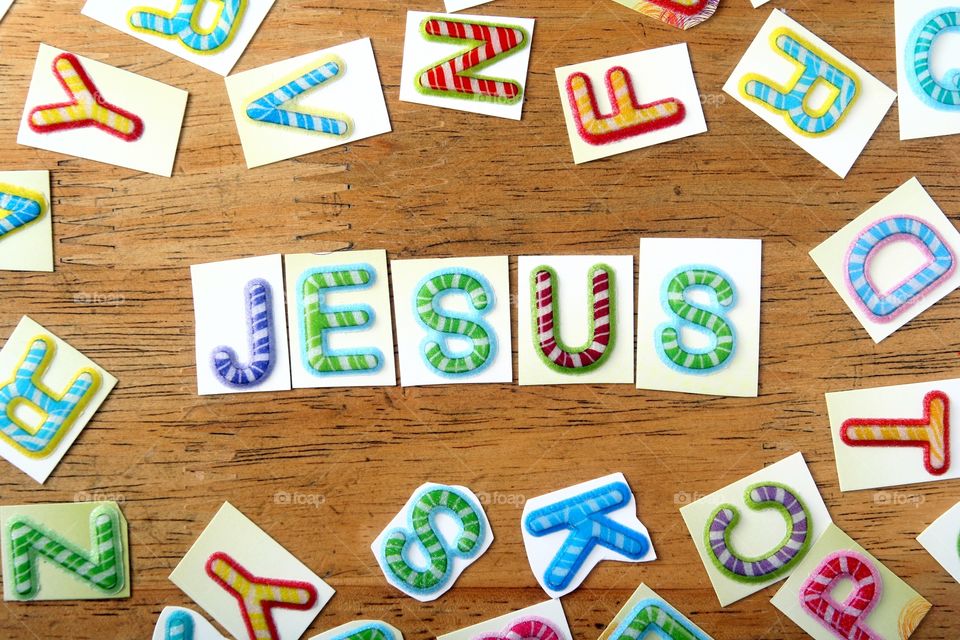 word jesus in colorful letters. word jesus spelled in colorful letters