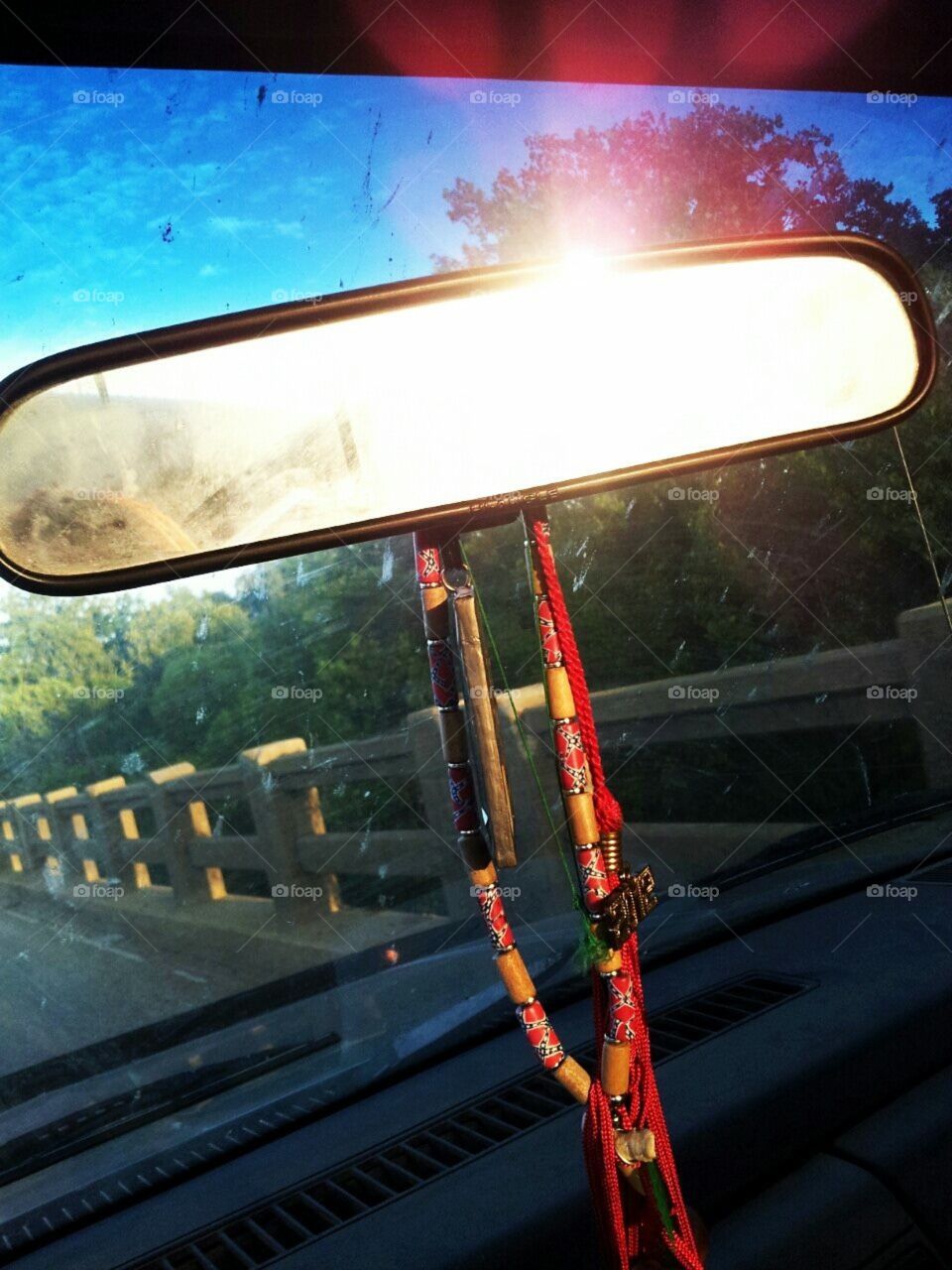 Louisiana sunrise in rear view mirror