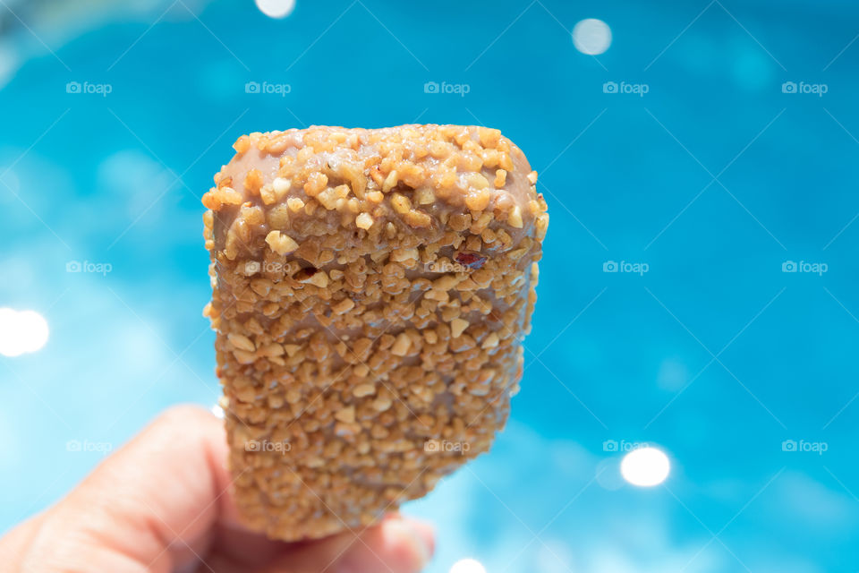 Having a delicious ice cream by the pool 