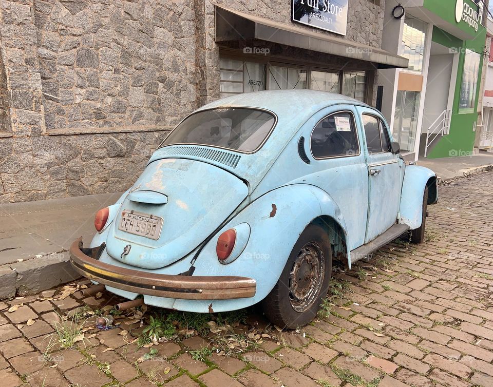 Vintage blue car parked in the street 