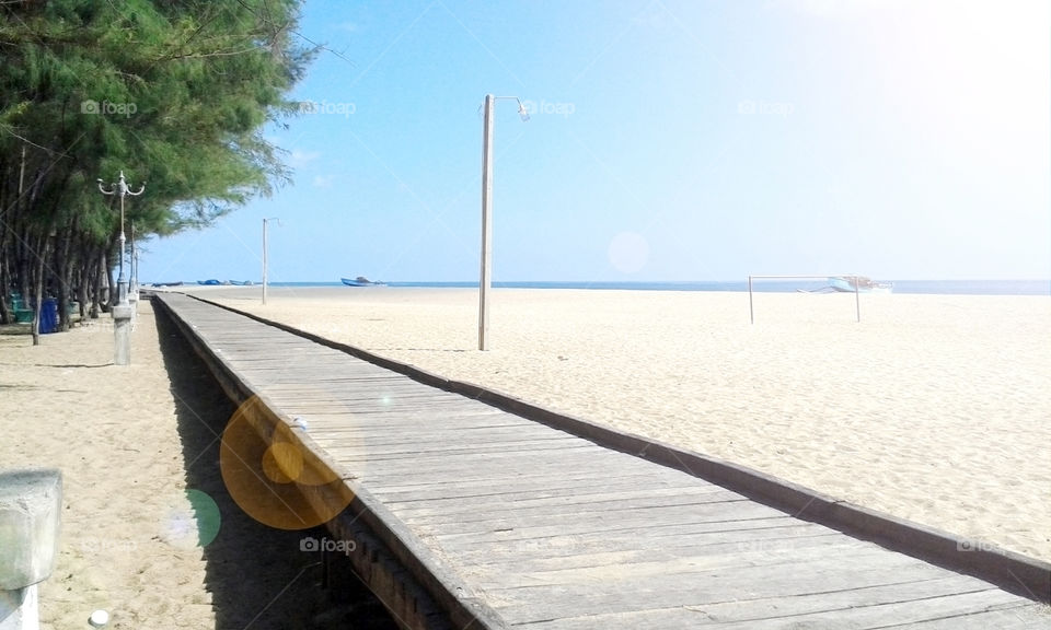 stand alone side walk in beach side. sunny beach side in a sunny day