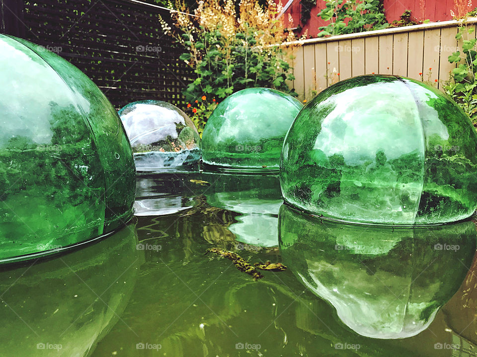 Glass spheres floating on water 