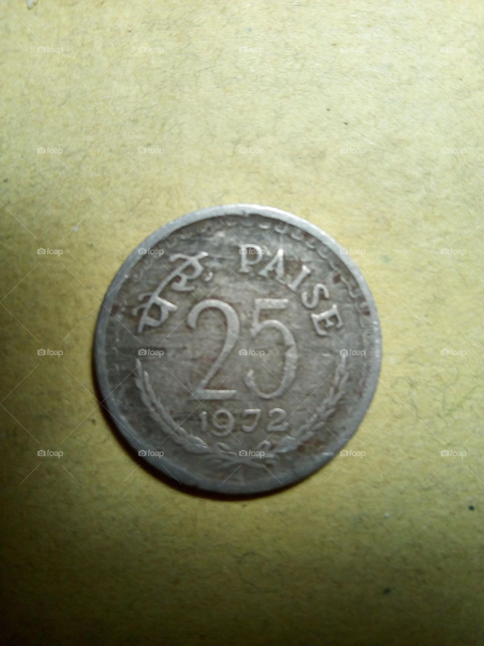 A coin of twenty five paise- 1/4 share of Indian Rupee issued by Government of India in 1972.