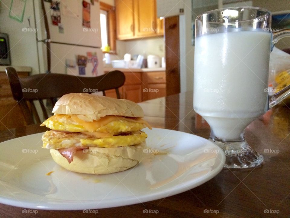 Breakfast Mouthful. This is a very delicious breakfast bagel I made with a glass of milk to wash it down.