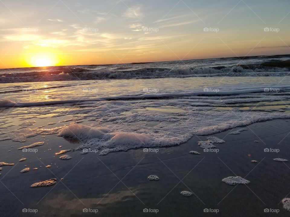 View of beach at sunset