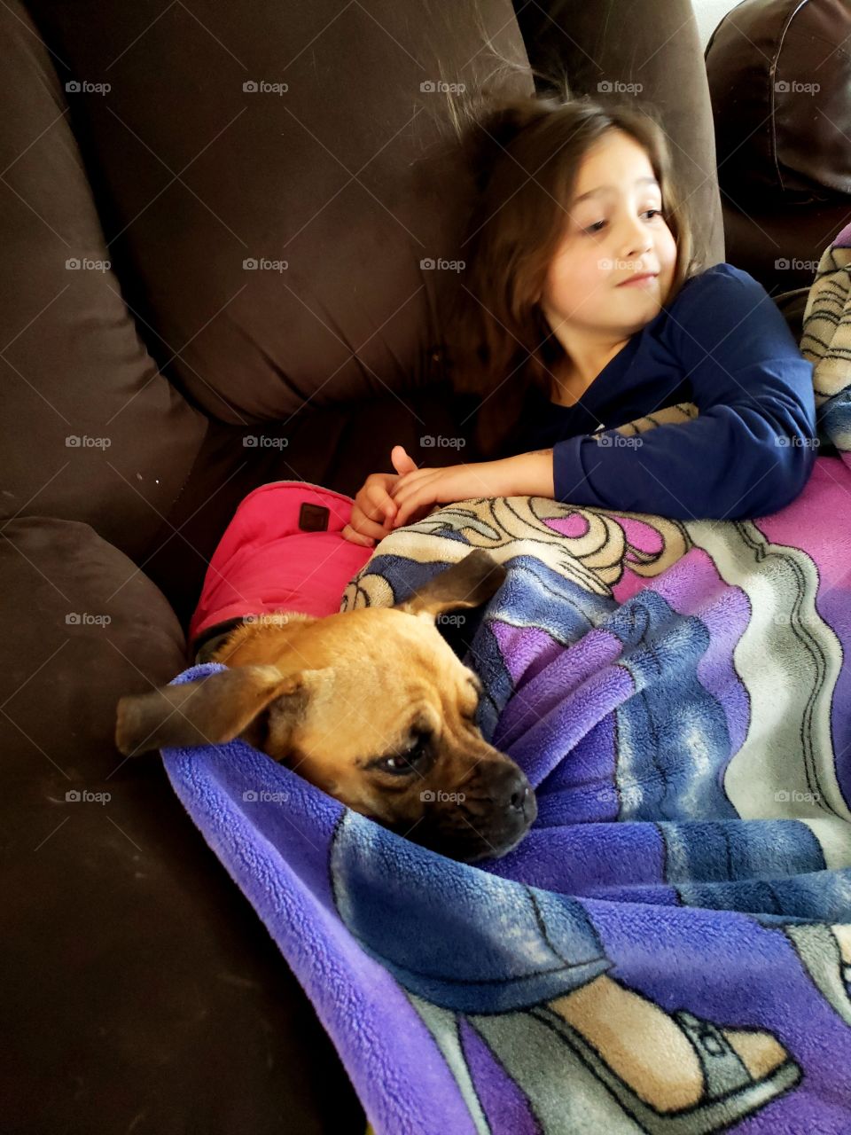 child with her puppy