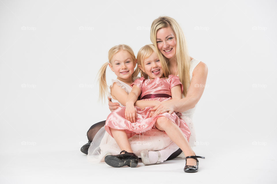 Happy family, mother with her two daughters of 6 and four years old.