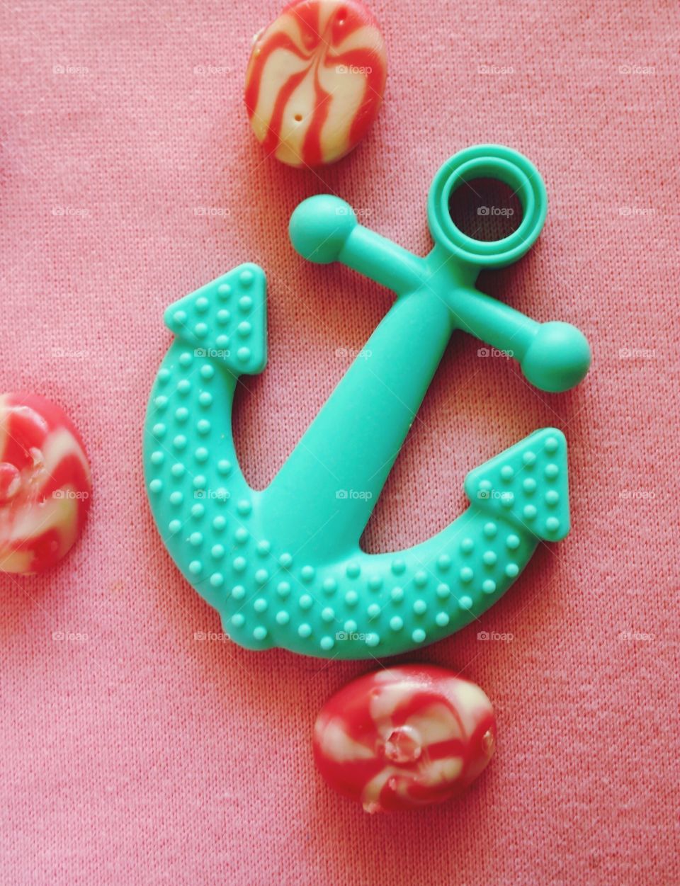 mint anchor on a pink background