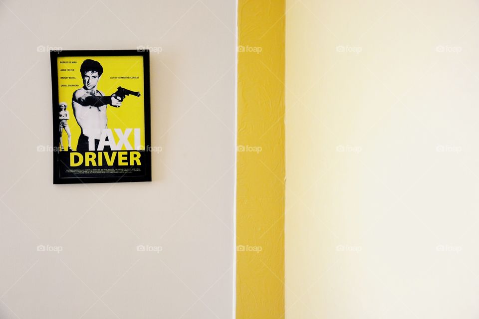 The taxi driver . A picture of my bedroom having a frame 