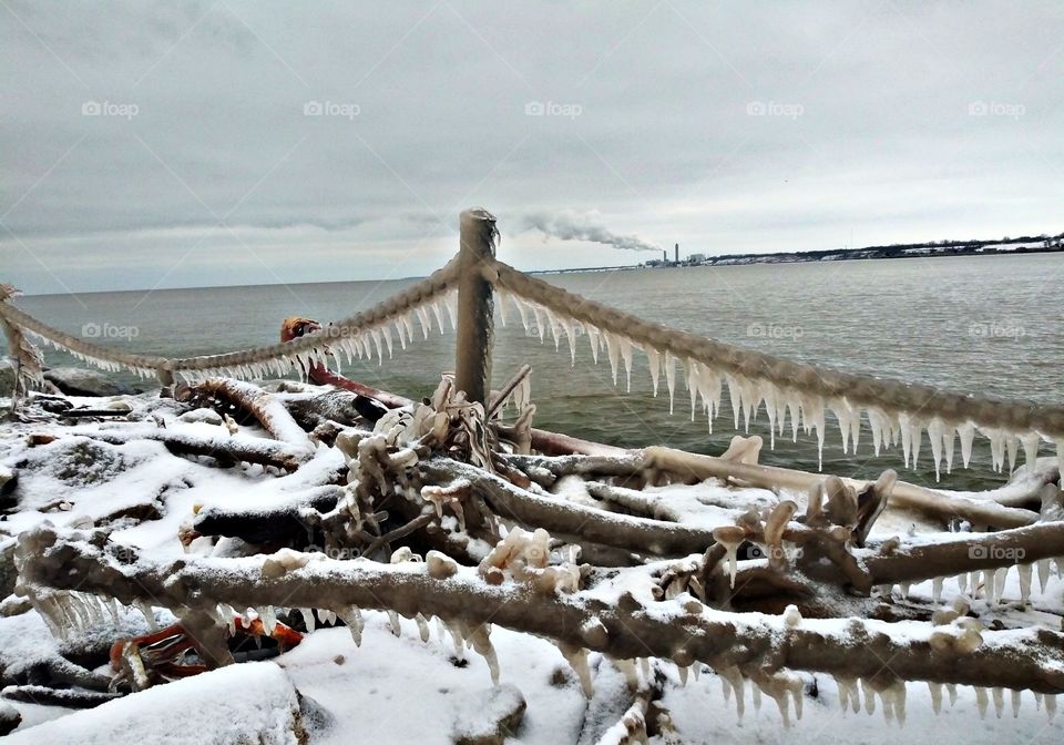 The chaotic frozen after math of a winter storm off the love pier of Grant Park. Photographer Lee La Beez of Beez Lee Art.