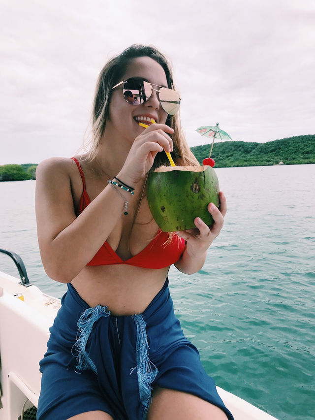 Having a delicious coconut. Summer loving. Colombian islands vacation. Amazing body with a better attitude. 