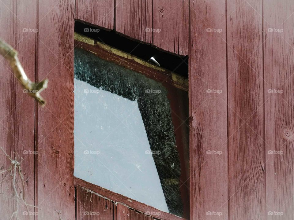 Barn window reflects