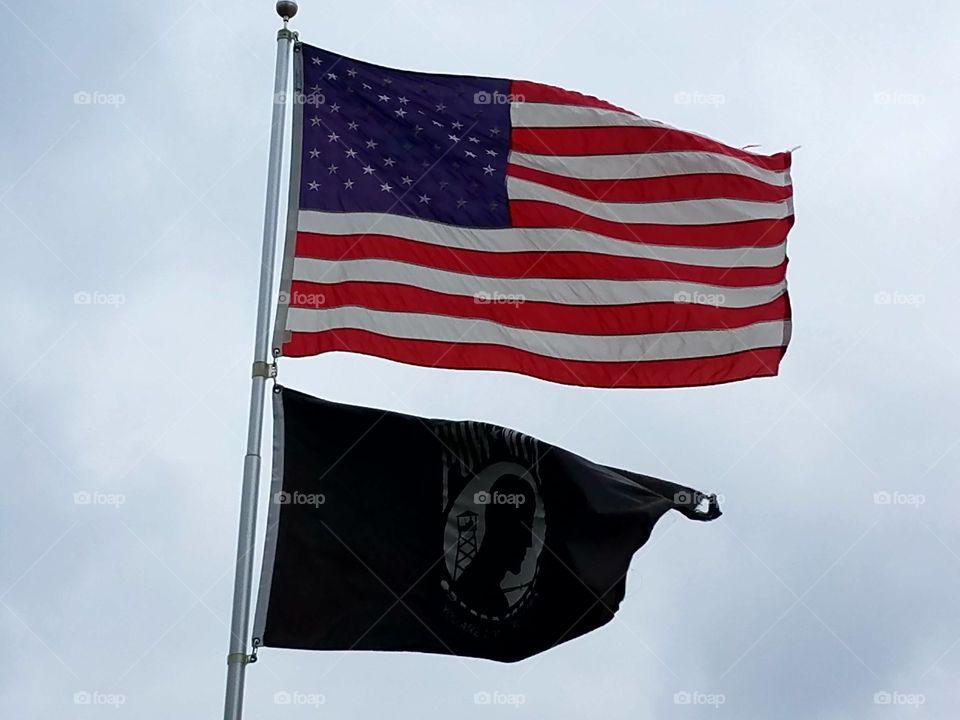 The flags waving in front of the Richland Center Courthouse