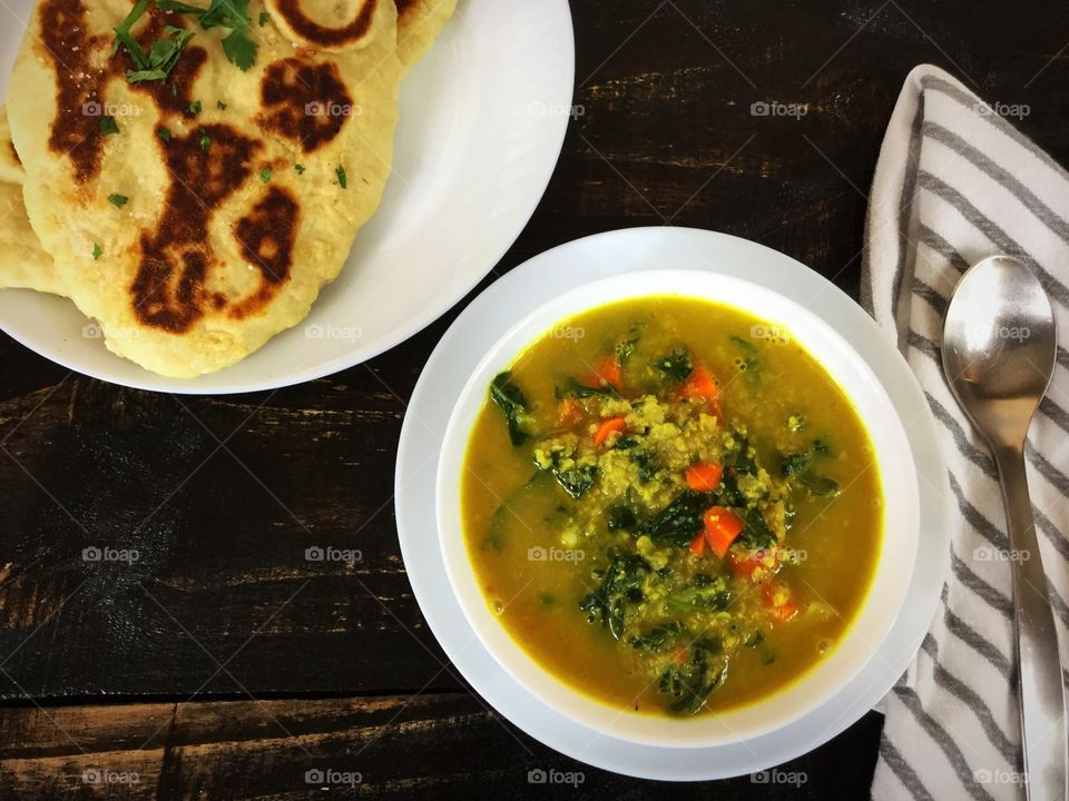 Curried cauliflower and kale soup with naan bread