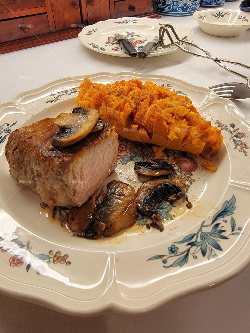 Pork Chop seared in olive oil and Worcestershire sauce a side of baked sweet potato with butter and cinnamon!