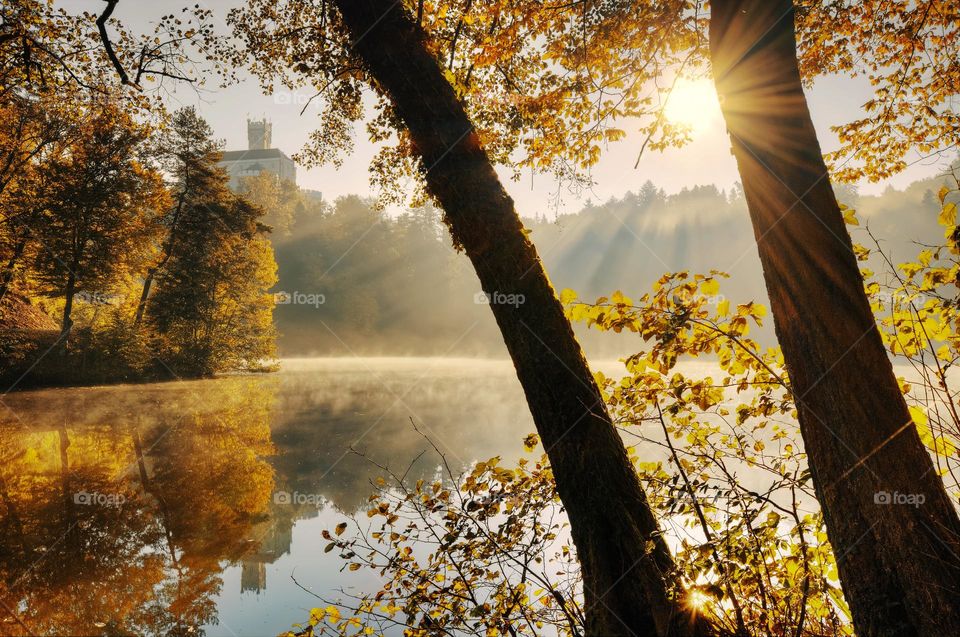 Sunny day at Trakošćan Castle reflected in Lake in Croatia, county hrvatsko zagorje