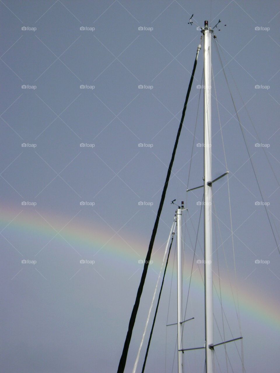 mast and rainbow. safe harbour