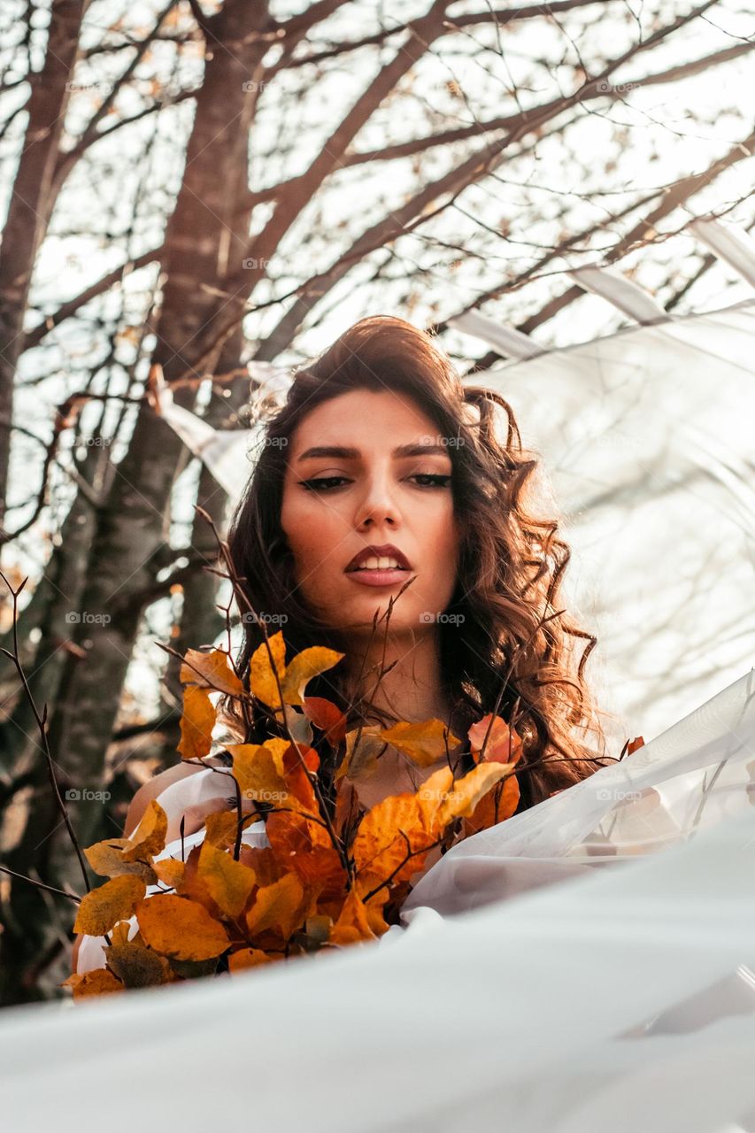beautiful portrait of a woman in the autumn forest