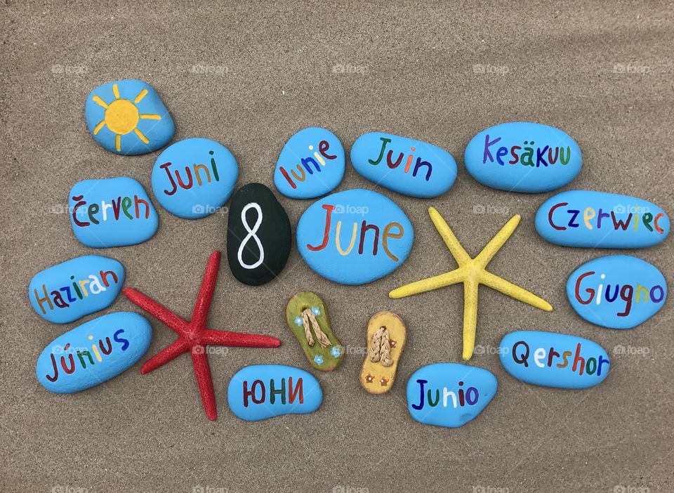 8 June, calendar date with colored stones and starfishes 